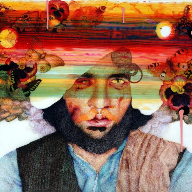 A photograph of Faiza Butt's art piece called Paracosm, featuring a man with a beard with colours overlayed on his face and butterflies around his head.